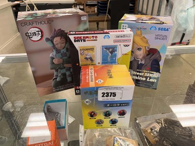 Lot 2375 - Anime figures, badges etc.