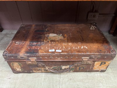 Lot 36 - Bound leather case with assorted stickers