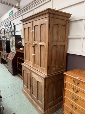Lot 52 - A full height stripped pine cupboard with two...