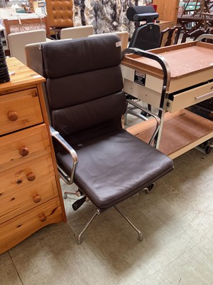 Lot 63 - Eames style swivel chrome framed and black...