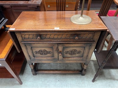 Lot 78 - Oak side unit with drop ends, drawers and...