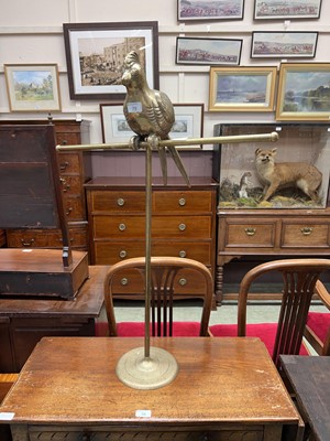 Lot 79 - Brass towel rail with parrot decoration
