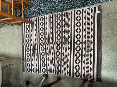 Lot 100 - A Debenhams woven rug with geometric decoration