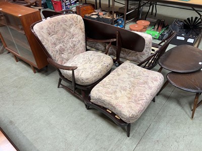 Lot 109 - A dark Ercol stick back armchair with matching...