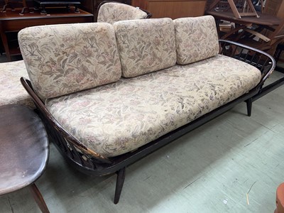 Lot 111 - A dark Ercol surfboard sofa