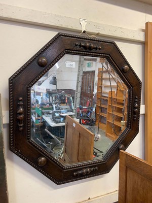 Lot 150 - An oak octagonal wall mirror