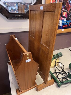 Lot 151 - An oak fire screen and a teak magazine rack