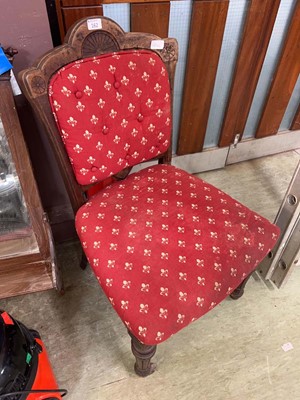 Lot 162 - A carved oak chair with fleur des lis upholstery