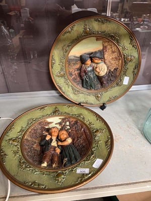 Lot 305 - Two decorative relief wall plates by Morters Hutz
