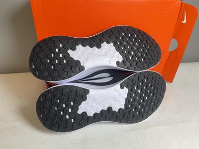 Lot 3796 - Nike UK10 revolution 7 trainers in black /...
