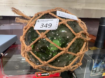 Lot 349 - Green glass ball with net