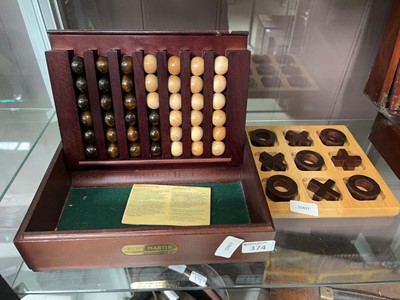 Lot 374 - Remi Martin wooden connect 4 game and a...