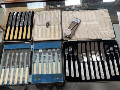 Lot 400 - Cased sets of flatware and a scale map...