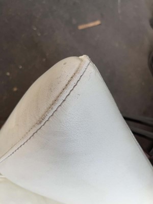 Lot 61 - Conran Content white leather wingback armchair...