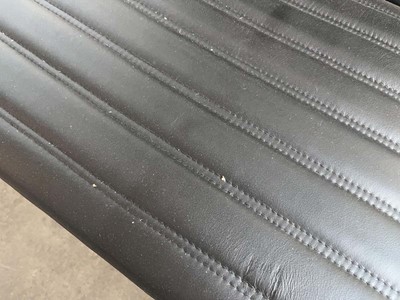 Lot 50 - 2 Leather low-level lounge chairs with ribbed...