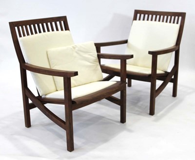 Lot 10 - Pair of walnut executive armchairs designed...
