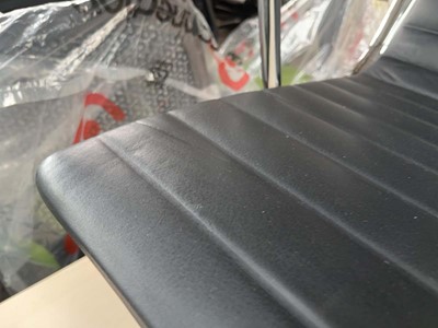 Lot 4 - Charles & Ray Eames for Vitra, an EA124 lounge...