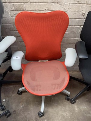 Lot 214 - Herman Miller Mirra chair with orange mesh...