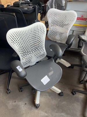 Lot 235 - 2 Herman Miller Mirra chairs with white back...
