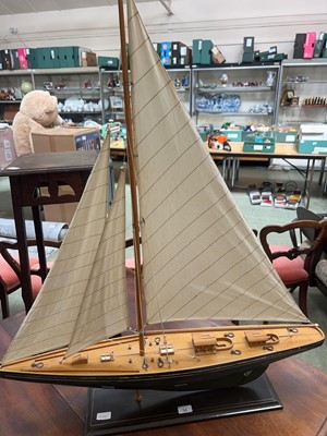 Lot 56 - A scratch built model of a sailing boat on stand.