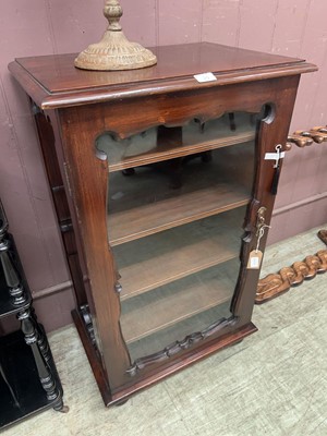 Lot 29 - An antique lockable stained wood cupboard With...