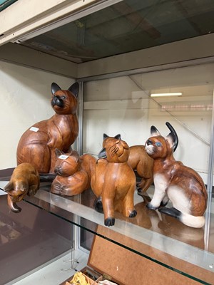 Lot 300 - Six carved wooden models of cats