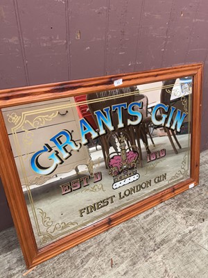 Lot 43 - A reproduction pine framed advertising mirror...