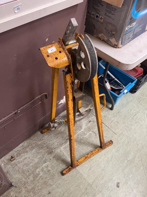 Lot 47 - A weathered yellow metalwork pipe bender on stand