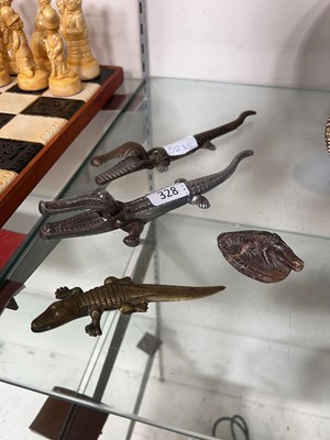 Lot 328 - 2 metalwork nutcrackers in the form of...