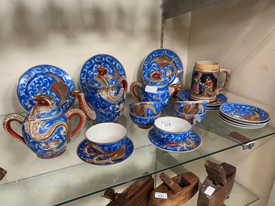 Lot 329 - A blue ground oriental style part tea set to...