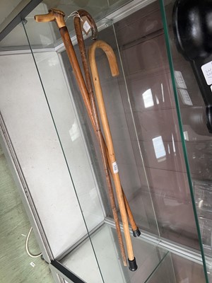 Lot 339 - A bones handled walking cane along with silver-...