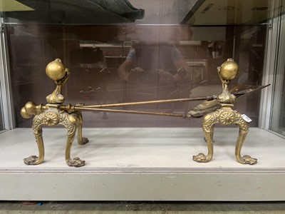 Lot 355 - A pair of ornate brass fire dogs along with a...
