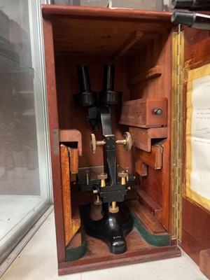 Lot 365 - A stained wooden cased 20th-century microscope