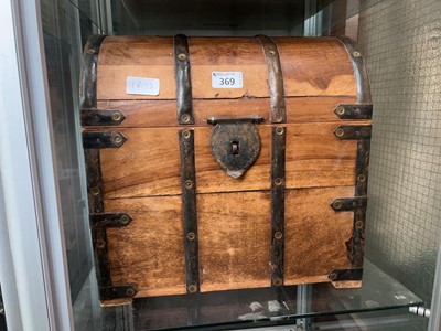 Lot 369 - A rustic metalwork banded desktop trunk