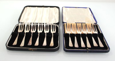 Lot 211 - Two boxed sets of six silver cake forks,...