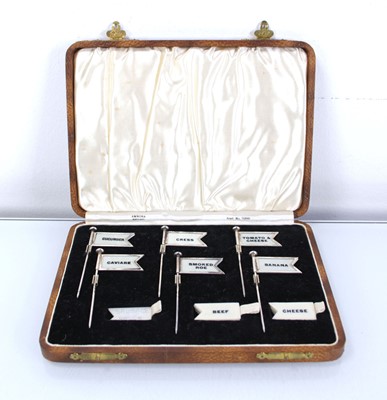Lot 213 - A cased set of six silver sandwich flags with...