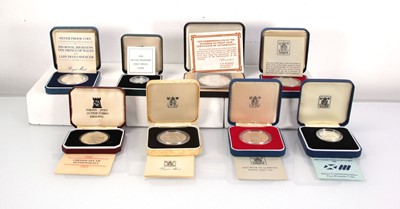 Lot 219 - A group of eight cased silver coins including...