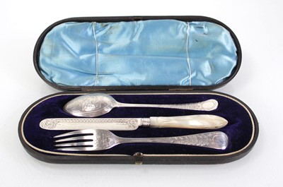 Lot 227 - A cased harlequin silver knife, spoon and fork,...