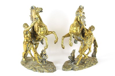 Lot 131 - After Guillaume Coustou, a pair of gilt metal...