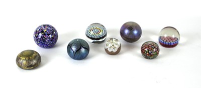 Lot 150 - A group of eight glass paperweights including...