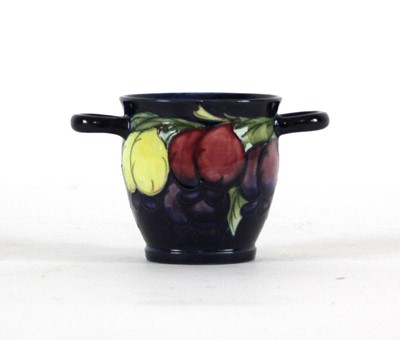Lot 166 - A William Moorcroft two-handled vase decorated...