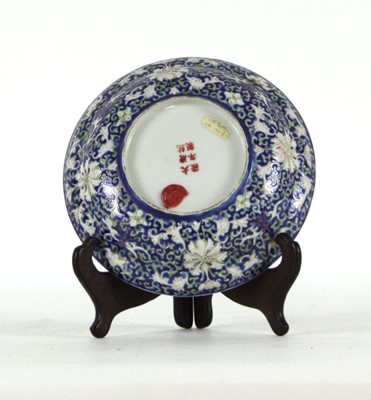 Lot 185 - A Chinese low bowl, the exterior with a blue...