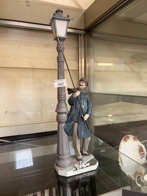 Lot 302 - A Lladro figurine of a lamp lighter