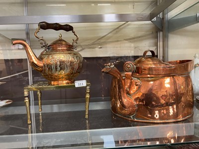 Lot 311 - An eastern style embossed tea pot on brass...