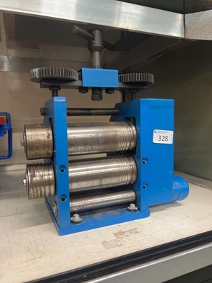 Lot 328 - A blue cast metal silversmith's press