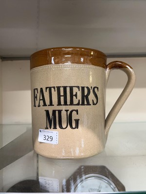Lot 329 - An oversized stoneware 'Father's Mug' by Moira...