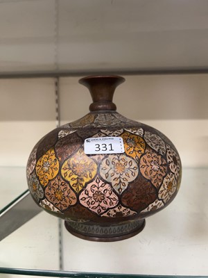 Lot 331 - An Indian metalware vase with floral decoration