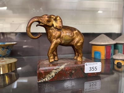 Lot 355 - A painted metalware sculpture of an elephant...
