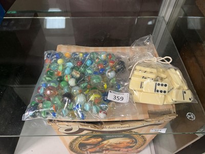 Lot 359 - A bag containing an assortment of marbles...