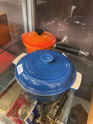 Lot 378 - A blue Le Creuset lidded oven pot, along with...